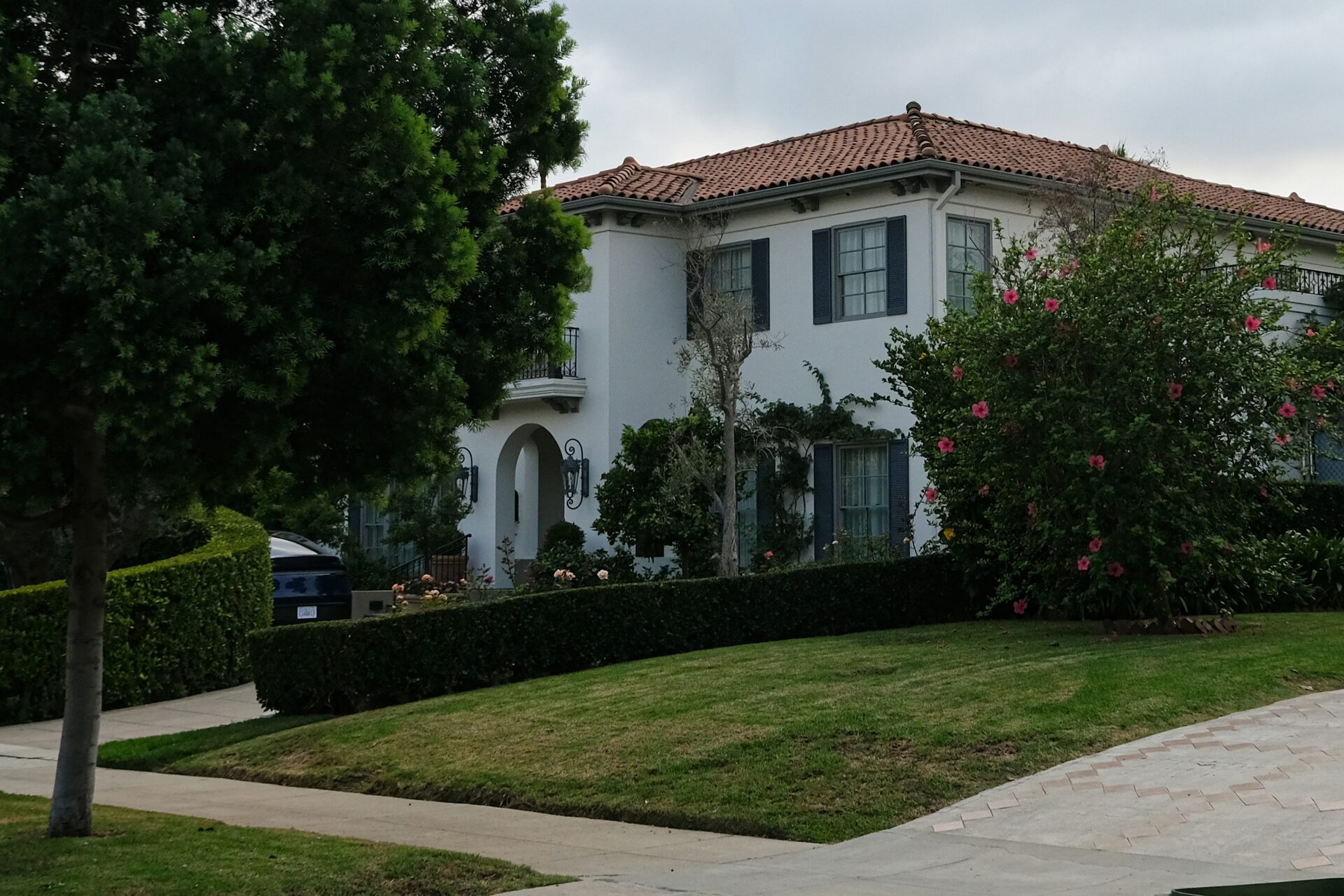 Elegant stucco residence with manicured garden landscaping, Irvine